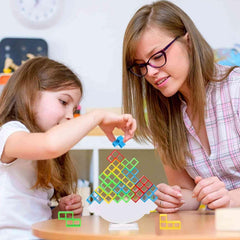 Woman and child playing with colorful puzzle toys at a table.