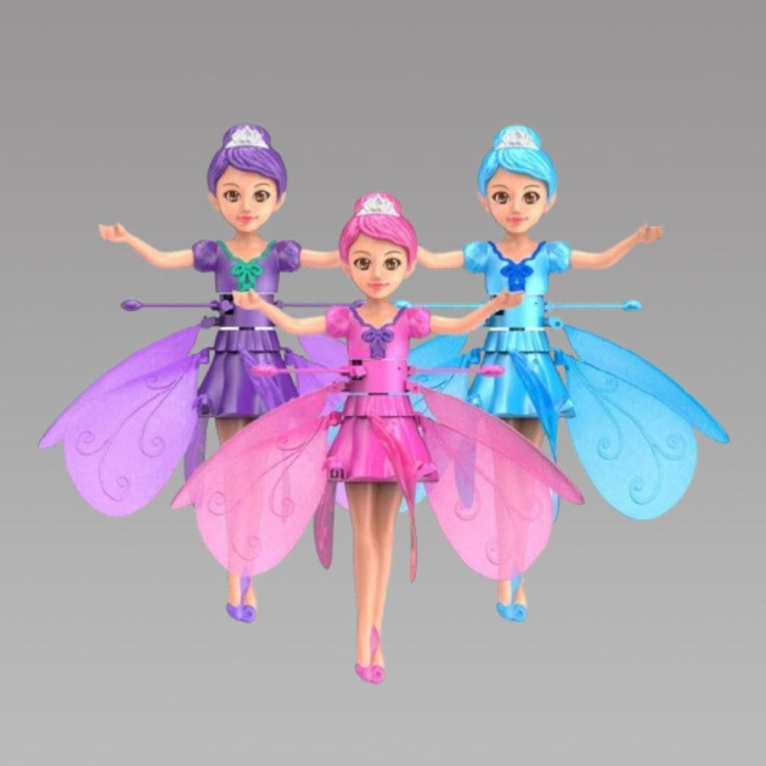 Three fairy dolls with colorful dresses and wings on a gray background