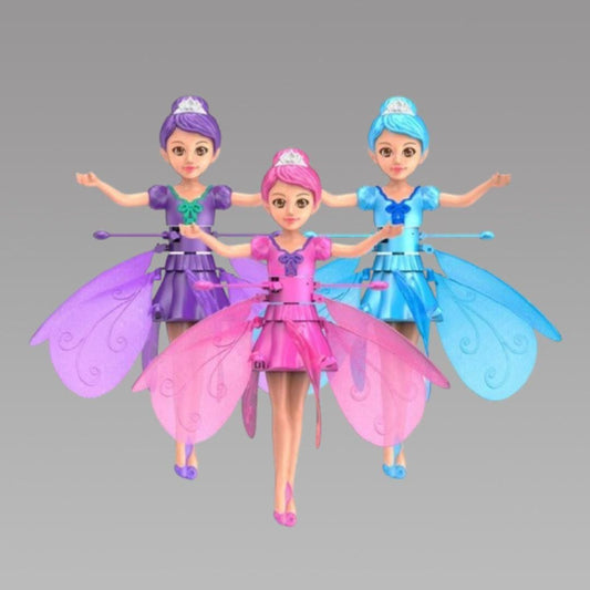 Three fairy dolls with colorful dresses and wings on a gray background